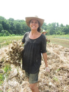 Claudia Harvesting Garlic